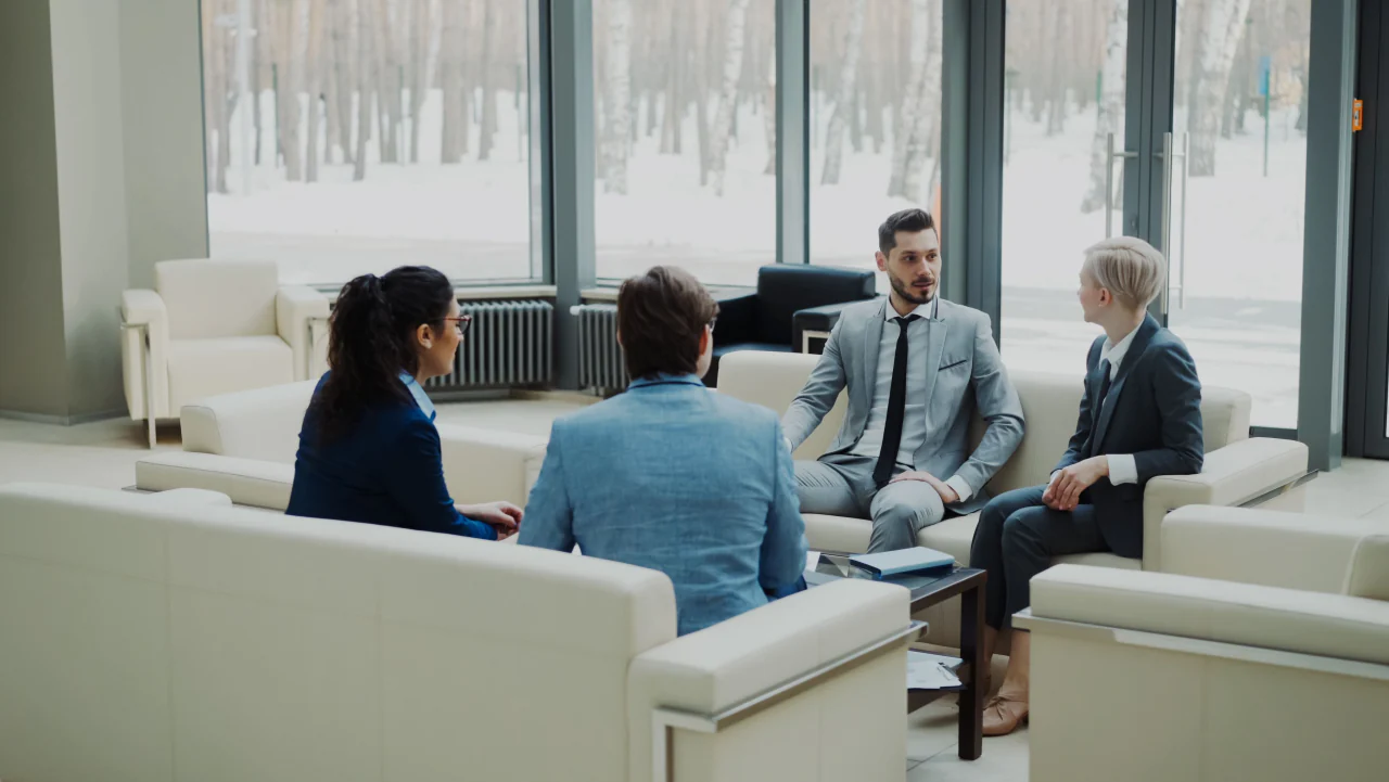 Advisers in discussion inside a contemporary office
